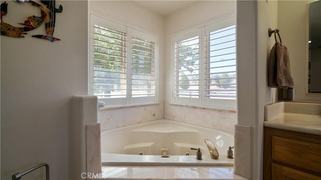 8920 Del Monte Ave, Yucca Valley, CA 92284 - bathroom with plenty of natural light, vanity, and a tub with jets