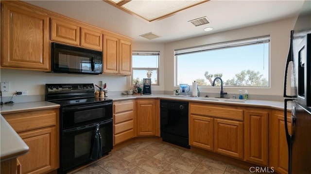 8920 Del Monte Ave, Yucca Valley, CA 92284 - kitchen with black appliances and light countertops