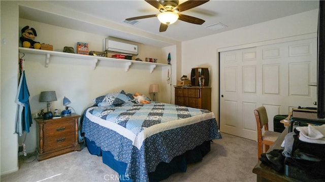 8920 Del Monte Ave, Yucca Valley, CA 92284 - bedroom featuring an AC wall unit, light carpet, a closet, and a ceiling fan