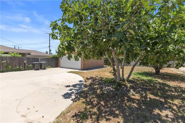 1256 Windsor Dr, San Bernardino, CA 92404 - view of side of home with a patio and an outdoor structure