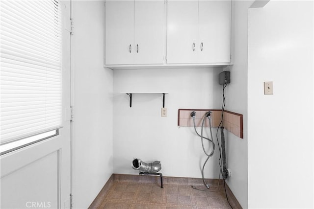1256 Windsor Dr, San Bernardino, CA 92404 - laundry area with hookup for a washing machine and cabinet space