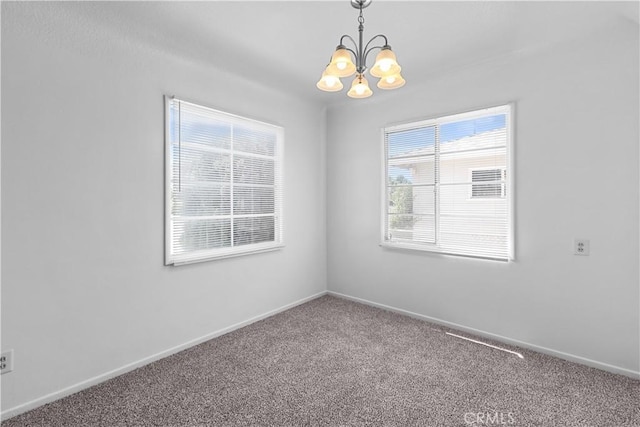 1256 Windsor Dr, San Bernardino, CA 92404 - carpeted empty room with a chandelier and healthy amount of natural light