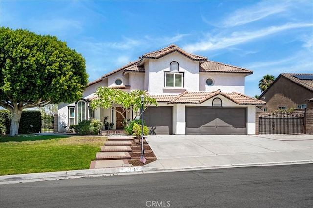 2151 Lyon Ave, Riverside, CA 92503 - mediterranean / spanish home featuring a gate, stucco siding, concrete driveway, and a tiled roof