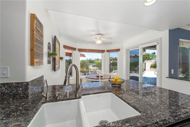 2151 Lyon Ave, Riverside, CA 92503 - kitchen with ornamental molding, a ceiling fan, and dark stone countertops