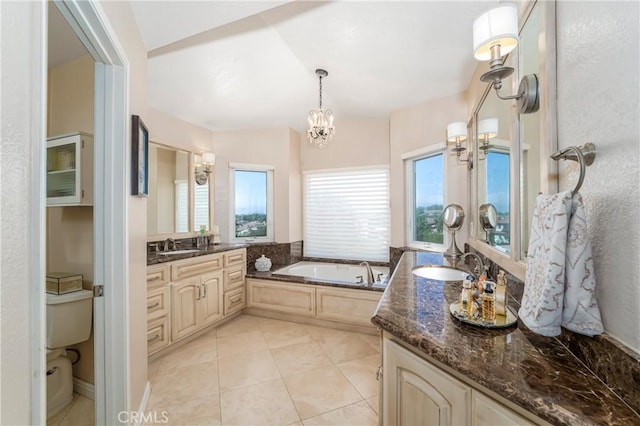 2151 Lyon Ave, Riverside, CA 92503 - bathroom featuring a chandelier, a garden tub, vanity, and tile patterned flooring
