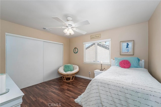 2151 Lyon Ave, Riverside, CA 92503 - bedroom with a closet, dark wood-style floors, and a ceiling fan