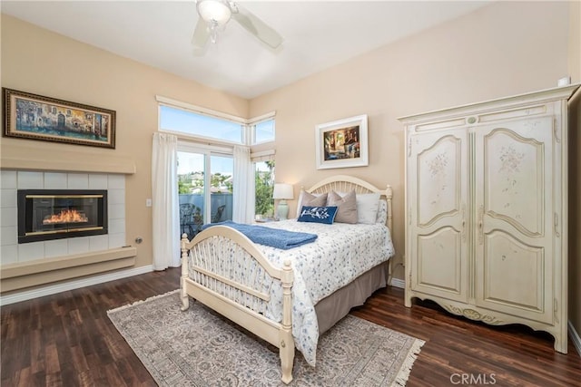 2151 Lyon Ave, Riverside, CA 92503 - bedroom with access to outside, dark wood finished floors, a tile fireplace, and a ceiling fan