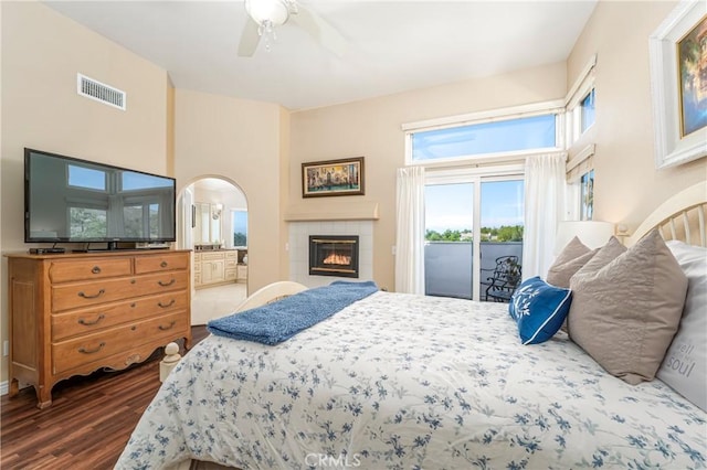 2151 Lyon Ave, Riverside, CA 92503 - bedroom with access to outside, arched walkways, wood finished floors, a tile fireplace, and a towering ceiling