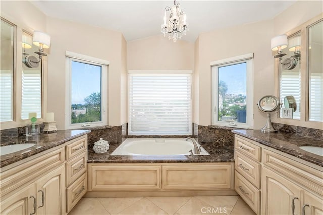 2151 Lyon Ave, Riverside, CA 92503 - full bath featuring plenty of natural light, tile patterned floors, a bath, two vanities, and vaulted ceiling