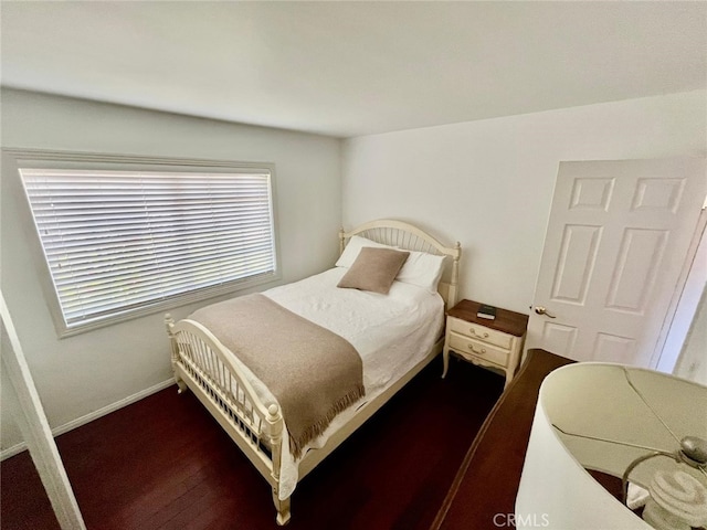 10116 Viking Ave, Northridge, CA 91324 - bedroom with baseboards and dark wood-style floors