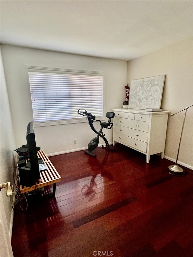 10116 Viking Ave, Northridge, CA 91324 - exercise area featuring dark wood-style floors and baseboards
