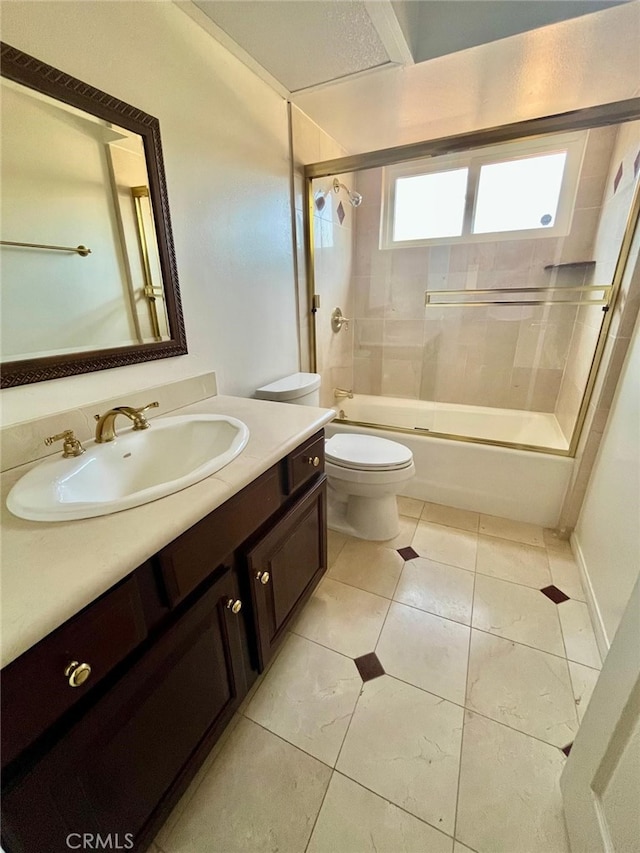 10116 Viking Ave, Northridge, CA 91324 - full bathroom featuring vanity, shower / bath combination with glass door, and tile patterned flooring