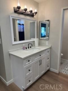 25715 Hogan Dr Unit B1, Valencia, CA 91355 - full bathroom featuring vanity and wood finished floors
