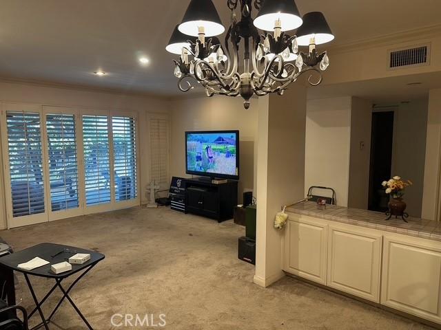4807 Beck Ave Unit 4, Valley Village, CA 91601 - living room featuring ornamental molding, light carpet, a chandelier, and recessed lighting
