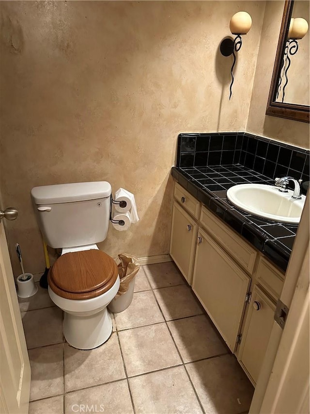 4807 Beck Ave Unit 4, Valley Village, CA 91601 - half bathroom featuring vanity, a textured wall, and tile patterned floors