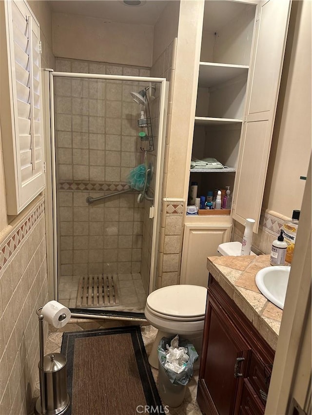 4807 Beck Ave Unit 4, Valley Village, CA 91601 - bathroom featuring tile walls, vanity, a shower stall, and wainscoting