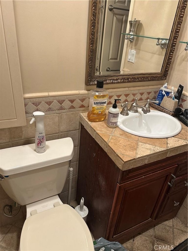 4807 Beck Ave Unit 4, Valley Village, CA 91601 - bathroom with vanity, a wainscoted wall, and tile walls