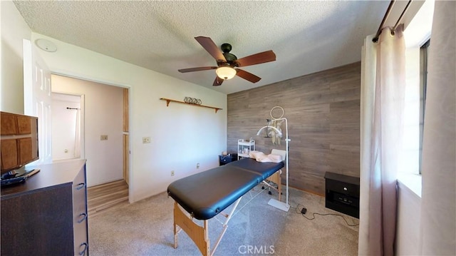 15233 Olive St, Hesperia, CA 92345 - office area with ceiling fan, a textured ceiling, carpet, and wood walls