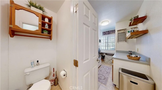 15233 Olive St, Hesperia, CA 92345 - bathroom with tile patterned floors and washer / dryer