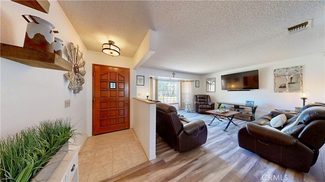 15233 Olive St, Hesperia, CA 92345 - living room featuring wood finished floors and a textured ceiling