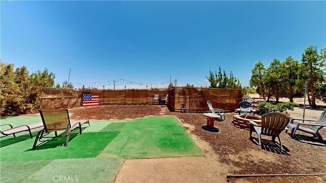 15233 Olive St, Hesperia, CA 92345 - view of yard featuring a fire pit