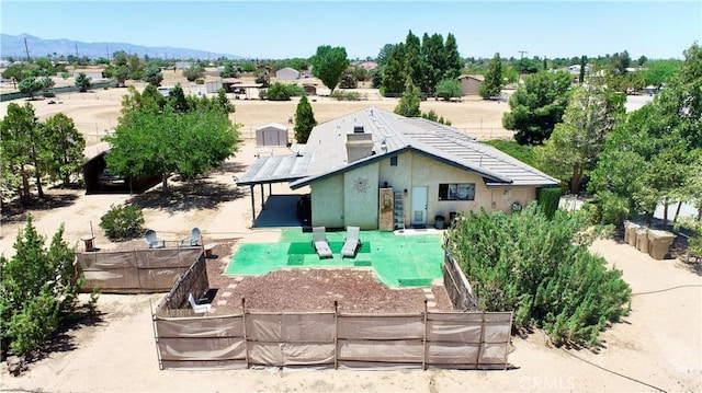 15233 Olive St, Hesperia, CA 92345 - rear view of property with stucco siding and a mountain view
