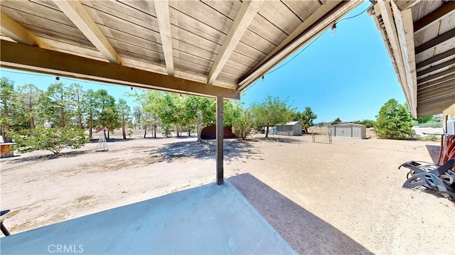 15233 Olive St, Hesperia, CA 92345 - view of patio / terrace with a shed