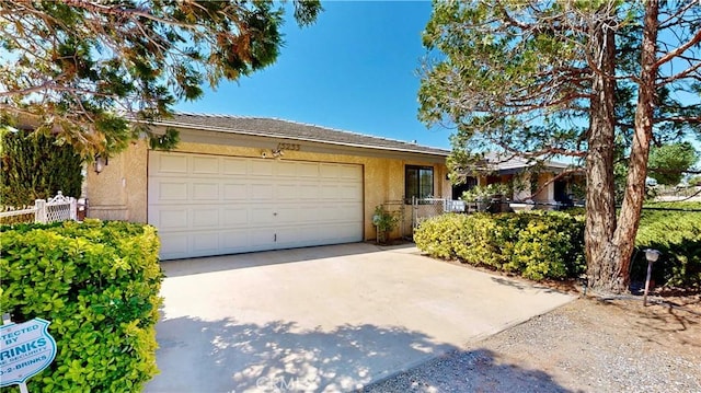 15233 Olive St, Hesperia, CA 92345 - single story home featuring stucco siding, concrete driveway, and an attached garage