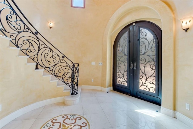 462 Pomello Dr, Claremont, CA 91711 - foyer entrance with arched walkways, french doors, and stairs