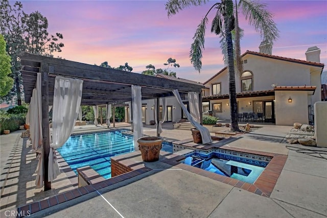 462 Pomello Dr, Claremont, CA 91711 - pool at dusk with an in-ground hot tub, a patio area, and an outdoor pool