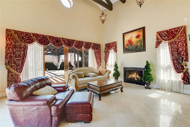 462 Pomello Dr, Claremont, CA 91711 - living area with a towering ceiling, a glass covered fireplace, tile patterned flooring, and beam ceiling