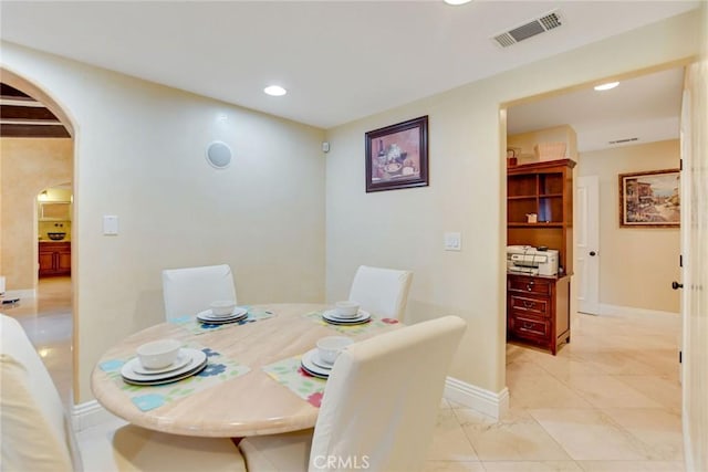 462 Pomello Dr, Claremont, CA 91711 - dining area featuring arched walkways, recessed lighting, and light marble finish flooring