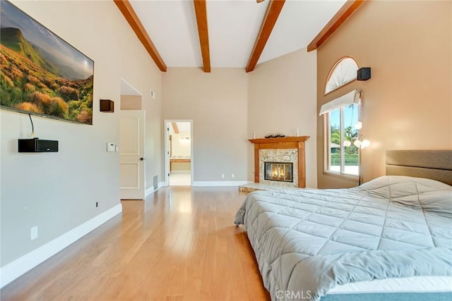462 Pomello Dr, Claremont, CA 91711 - bedroom with wood finished floors, beam ceiling, a high ceiling, and a high end fireplace