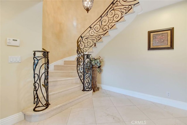 462 Pomello Dr, Claremont, CA 91711 - staircase with baseboards and marble finish flooring