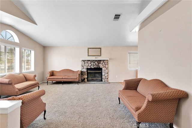 26969 Lakeview Dr, Helendale, CA 92342 - carpeted living area with lofted ceiling and a stone fireplace