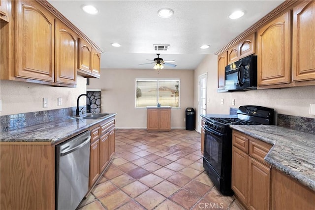 26969 Lakeview Dr, Helendale, CA 92342 - kitchen featuring black appliances, a ceiling fan, dark stone counters, recessed lighting, and brown cabinets