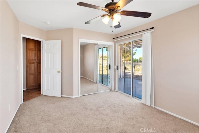 26969 Lakeview Dr, Helendale, CA 92342 - unfurnished bedroom featuring access to outside, carpet floors, and ceiling fan