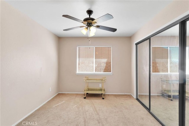 26969 Lakeview Dr, Helendale, CA 92342 - unfurnished bedroom with carpet, a closet, and a ceiling fan