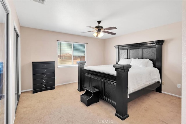 26969 Lakeview Dr, Helendale, CA 92342 - bedroom with light carpet, ceiling fan, and a closet