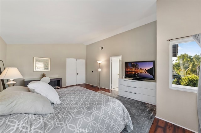 40236 Holden Cir, Temecula, CA 92591 - bedroom with dark wood-style floors and high vaulted ceiling
