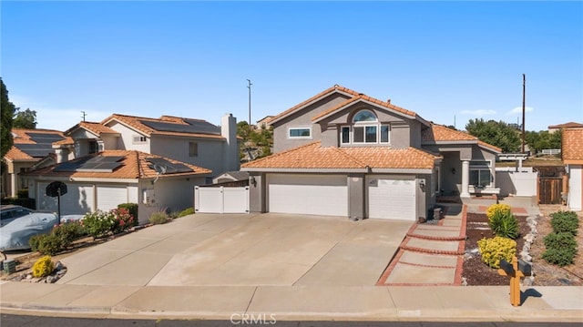 40236 Holden Cir, Temecula, CA 92591 - view of front of house with a gate, stucco siding, driveway, a tiled roof, and a garage