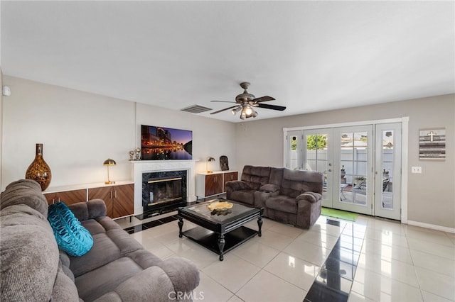 40236 Holden Cir, Temecula, CA 92591 - living room with light tile patterned flooring, a ceiling fan, french doors, and a premium fireplace