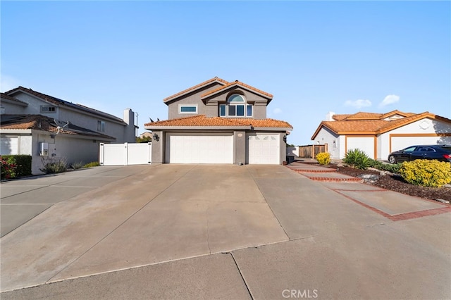 40236 Holden Cir, Temecula, CA 92591 - view of front of property with concrete driveway, stucco siding, a tiled roof, a garage, and a gate