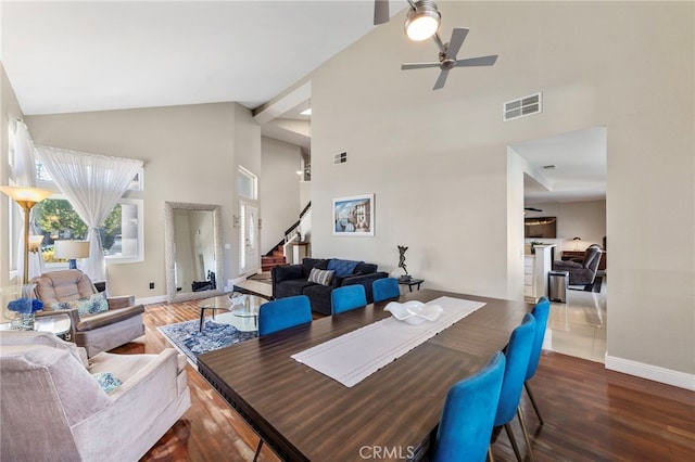 40236 Holden Cir, Temecula, CA 92591 - dining area featuring high vaulted ceiling, wood finished floors, a ceiling fan, and stairway