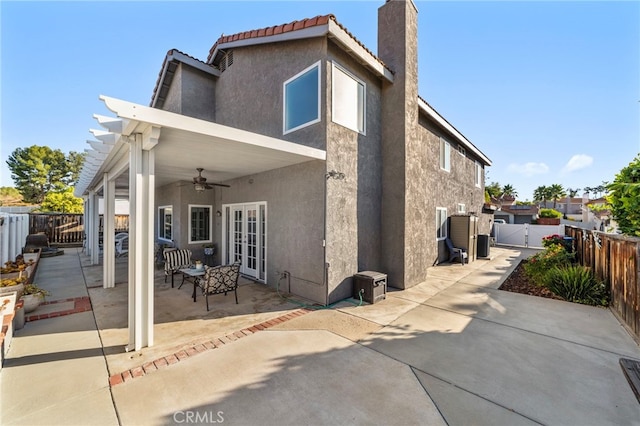 40236 Holden Cir, Temecula, CA 92591 - rear view of property featuring stucco siding, a ceiling fan, a patio area, and a fenced backyard