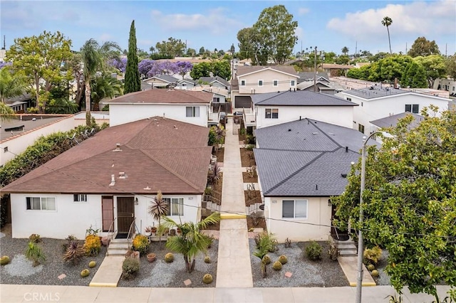 817 Mira Mar Ave, Long Beach, CA 90804 - view of front facade with stucco siding, roof with shingles, and a residential view