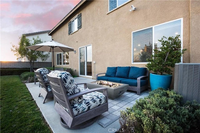 11829 Confluence Dr, Jurupa Valley, CA 91752 - patio terrace at dusk with an outdoor living space with a fire pit and a patio area
