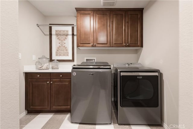 11829 Confluence Dr, Jurupa Valley, CA 91752 - laundry area with washer and clothes dryer and cabinet space