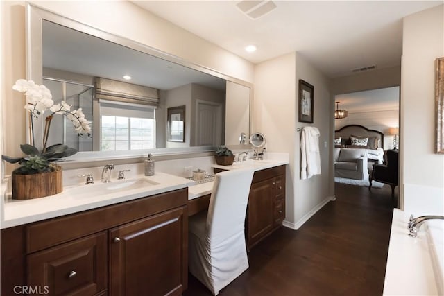 11829 Confluence Dr, Jurupa Valley, CA 91752 - full bathroom featuring double vanity, wood finished floors, and a shower stall
