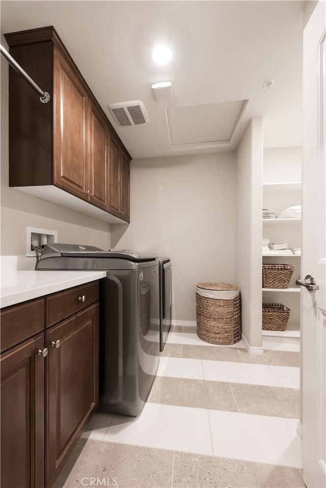 11829 Confluence Dr, Jurupa Valley, CA 91752 - laundry room featuring cabinet space, washing machine and clothes dryer, and light tile patterned flooring